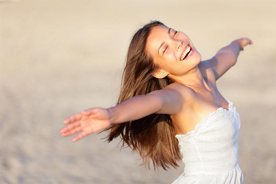 A beautiful girl smiling while spreading her hands
