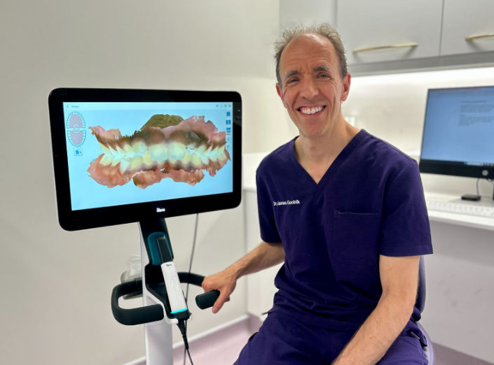dr james goolnik sitting in the surgery next to the itero scanner
